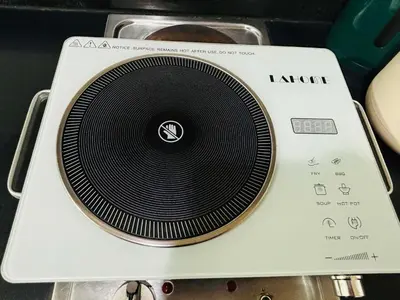 a white router with a black disk on top at Shore Balcony MOA Price worthy Wifi Pool Netflix in Manila