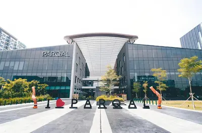 a parking lot in front of a large building at Cozy Family Suite with City View near City of Dreams Casino, Airport, Solaire, Okada, Ayala Malls and MOA in Manila
