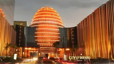a tall building with a lot of lights on it at Cozy Family Suite with City View near City of Dreams Casino, Airport, Solaire, Okada, Ayala Malls and MOA in Manila