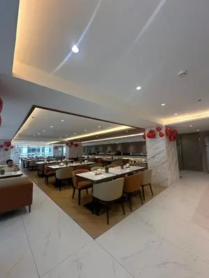 a dining room with tables and chairs in a restaurant at Cozy Family Suite with City View near City of Dreams Casino, Airport, Solaire, Okada, Ayala Malls and MOA in Manila