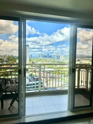 a window in a building with a view of a city at Vacation at Munti in Manila