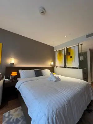 a bedroom with a large white bed in a room at Hotel Residence at Novotel in Manila