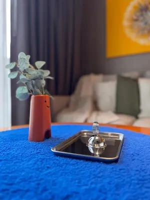 a cell phone sitting on top of a blue table at Hotel Residence at Novotel in Manila