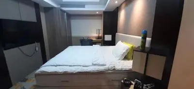 a bedroom with a large bed with white sheets at Shell Residences Condominium Philippines, Manila, Pasay City in Manila