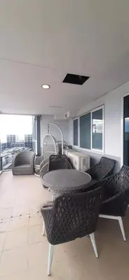 a dining room with a table and chairs at Shell Residences Condominium Philippines, Manila, Pasay City in Manila