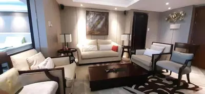 a living room with couches and a coffee table at Shell Residences Condominium Philippines, Manila, Pasay City in Manila