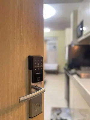 a wooden door with a door handle in a kitchen at Transient Home Lancin in Manila