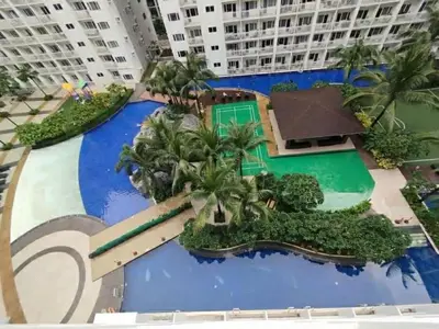 a model of a resort with palm trees and a swimming pool at Jay's Staycation at Shore Residences Pasay in Manila