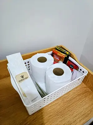 a basket filled with toilet paper on a table at The Atherton Condominium 1 Bedroom Staycation in Manila