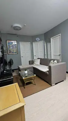 a living room with a couch and a coffee table at Condotels by Macobs in Manila