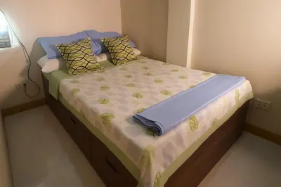 a small bed in a small room with at CLBC Residences New home in the heart of Laguna in Biñan
