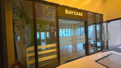 a view of the entrance to a day care building at Elegant Central 1BR BGC 11P Uptown Parksuites T2 in Manila