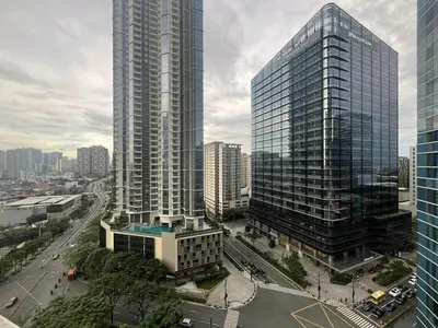 a view of a city with tall buildings at Elegant Central 1BR BGC 11P Uptown Parksuites T2 in Manila
