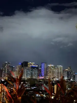 a view of a city skyline at night at Midhaven Suite in Manila