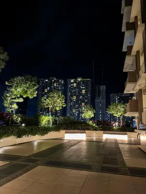 a night view of a city with tall buildings at Midhaven Suite in Manila
