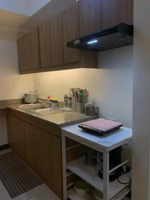 a kitchen with a sink and a counter top at 2BR 38th flr SIESTA SPACE in PRISMA Residences in Manila