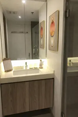 a bathroom with a sink and a mirror at Casa Alea Serenity by TinTan - Cozy 3BR Condo Unit in Manila