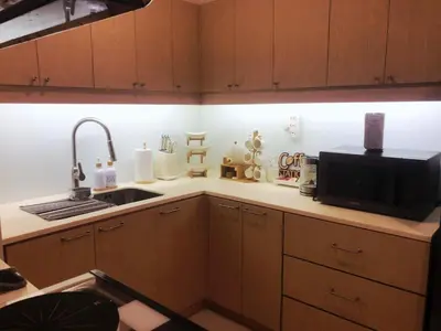 a kitchen with a sink and a microwave at Casa Alea Serenity by TinTan - Cozy 3BR Condo Unit in Manila
