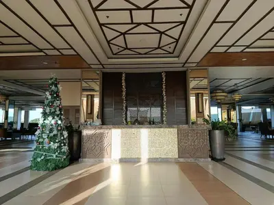 a christmas tree in the middle of a lobby at Casa Alea Serenity by TinTan - Cozy 3BR Condo Unit in Manila