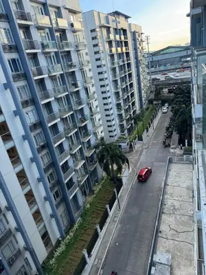 a street in a city with tall buildings at 1 Bedroom Unit terminal 3 Airport By ASD Condotel in Manila