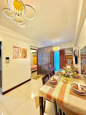a kitchen and dining room with a table and chairs at 1 Bedroom Unit terminal 3 Airport By ASD Condotel in Manila