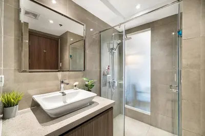 a bathroom with a sink and a shower at Elegant Studio City View near Airport, City of Dreams, Okada, Solaire, PARQAL, Ayala Malls, and MOA in Manila