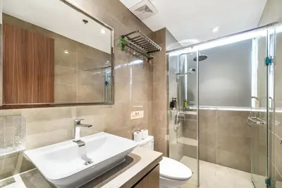 a bathroom with a sink and a shower at Elegant 2BR City View near City of Dreams, Okada, Solaire, PARQAL, Ayala Malls, MOA, and Airport in Manila