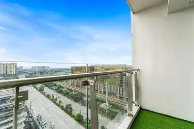 a balcony with a view of a city at Elegant 2BR City View near City of Dreams, Okada, Solaire, PARQAL, Ayala Malls, MOA, and Airport in Manila