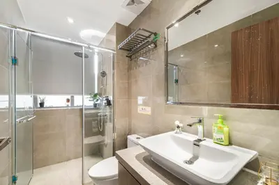 a bathroom with a sink and a shower and a toilet at Elegant 2BR City View near City of Dreams, Okada, Solaire, PARQAL, Ayala Malls, MOA, and Airport in Manila