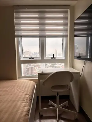 a bedroom with a desk and a bed and a window at New 1BR Condo at The Camden Place Near DLSU Manila in Manila