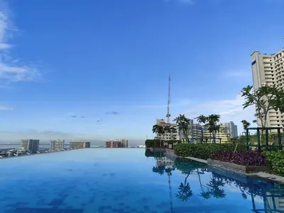 a large swimming pool on the roof of a building at New 1BR Condo at The Camden Place Near DLSU Manila in Manila