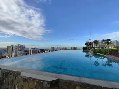 a large swimming pool on the roof of a building at New 1BR Condo at The Camden Place Near DLSU Manila in Manila