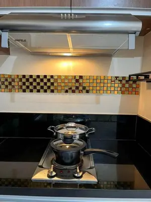 a pot on top of a stove in a kitchen at Family Condotels by Gerry in Manila