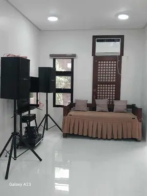 a room with a bed and a television and a camera at Sehaliah Agricultural Farm Resort in Amadeo