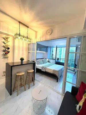 a bedroom with a bed and a desk in it at Guest House Ground Zero in Manila