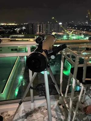 a camera on a tripod on top of a building at Guest House Ground Zero in Manila