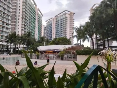 a view of the beach in front of buildings at A&A staycation in Manila