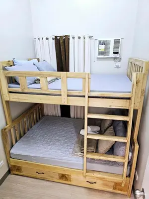 two bunk beds in a room at 3BR, 5 Beds, With Pool, Wifi, Netflix, Parking in Manila