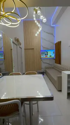 a room with a table and chairs and a couch at 3BR, 5 Beds, With Pool, Wifi, Netflix, Parking in Manila