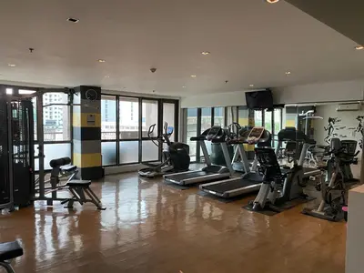 a gym with treadmills and cardio equipment in a building at Lowest Room Rate in Makati with fast wifi & view in Manila