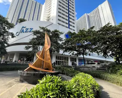 a statue of a boat in front of a building at Jazz Residences Condo in Manila