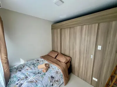 a small bedroom with a bed with a teddy bear on it at Studio with Balcony, TV Netflix near Shaw MRT Station in Manila