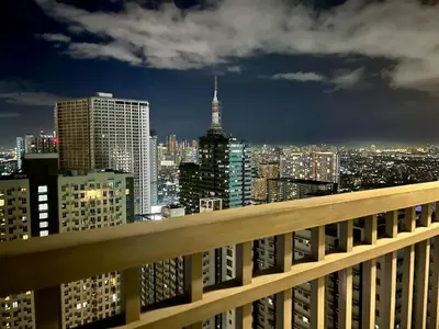 a view of a city at night from a building at Studio with Balcony, TV Netflix near Shaw MRT Station in Manila