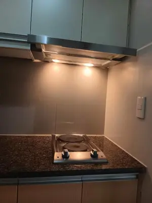 a kitchen with a stove top in a kitchen at Spacious Studio 3B C5 in Manila