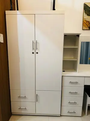 a white cabinet in a kitchen with white cabinets at Melscape Lush Residence 1BR Unit in Sampong