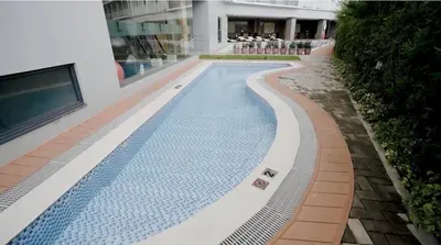 a swimming pool in the middle of a building at Melscape Lush Residence 1BR Unit in Manila