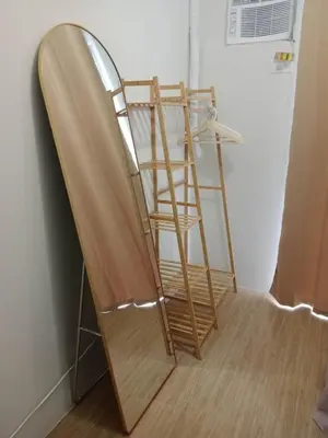 a wooden ladder sitting next to a wall at Raku Home - Urban Resort Living in Manila