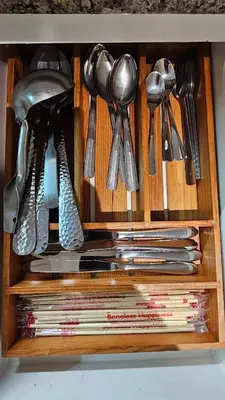 a wooden drawer with utensils in it at One Bedroom Premier at Eastwood Global Plaza Luxury Residences in Manila