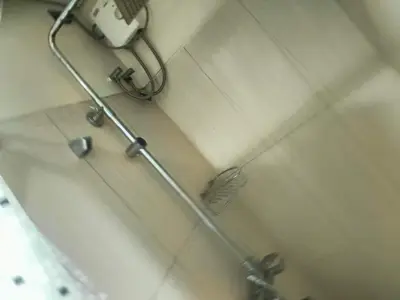 a shower stall with a shower head in a bathroom at Sea Residences peya in Manila
