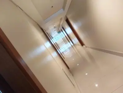a stainless steel refrigerator in a room at Sea Residences peya in Manila